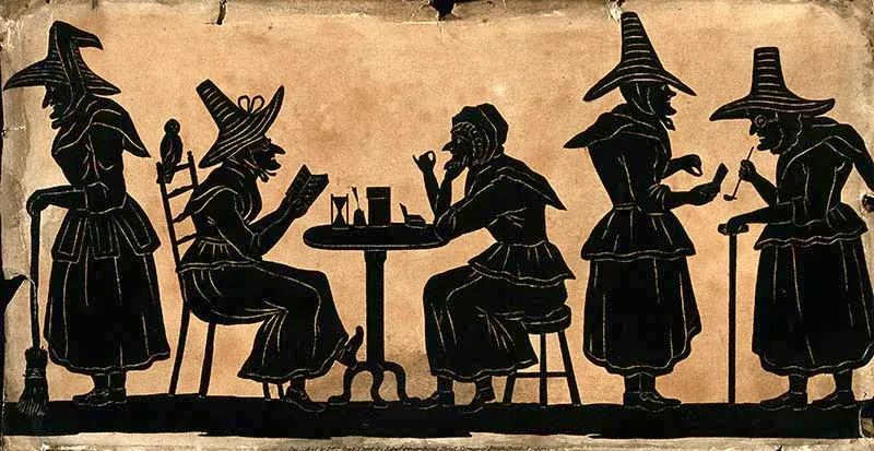 five silhouetted witches